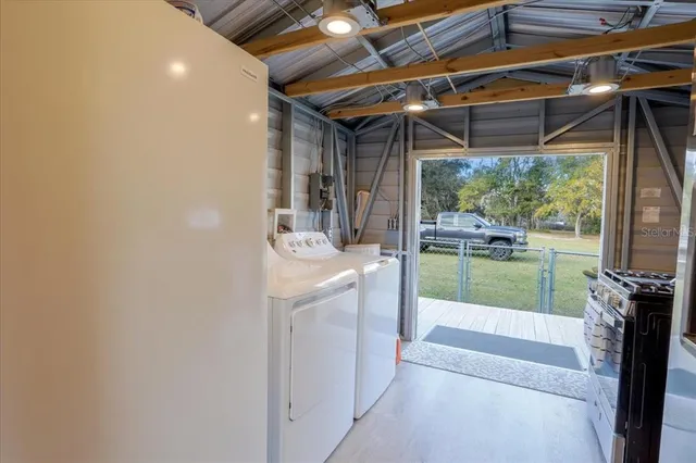 a bathroom with a sink a mirror and next to a window