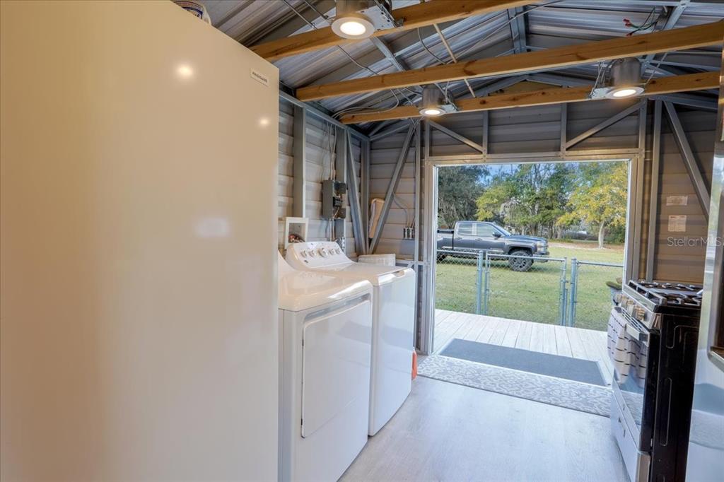 5336 County Road 791 Lake Butler, FL 32054 - Photo 12 of 25 a bathroom with a sink a mirror and next to a window