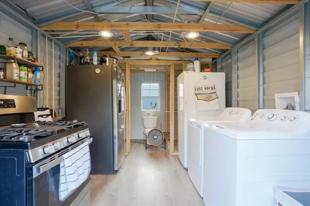 a kitchen that has a lot of stainless steel appliances
