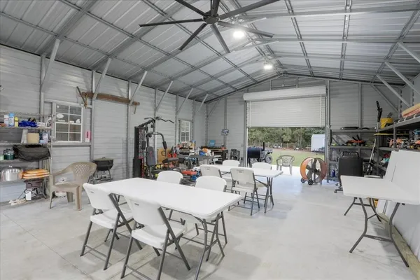 a view of a dining room with furniture water and mountain view