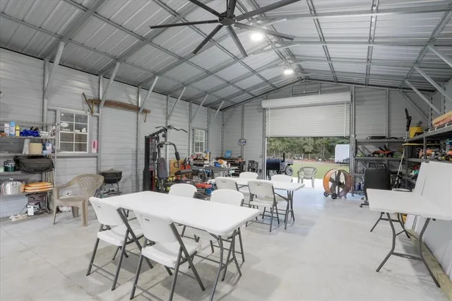 a view of a dining room with furniture water and mountain view