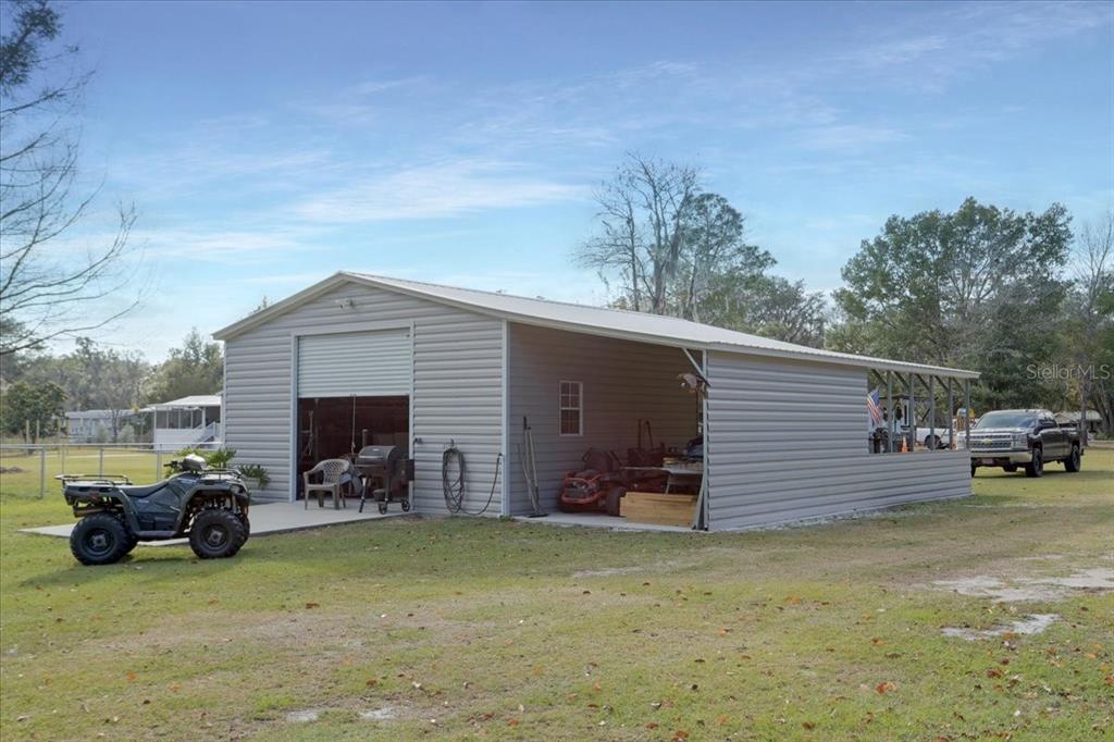 5336 County Road 791 Lake Butler, FL 32054 - Photo 9 of 25 a view of a patio with two chairs and a table