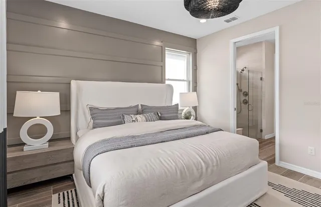 a bedroom with a bed and a window