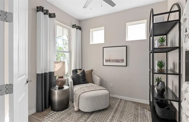 a living room with furniture and a window