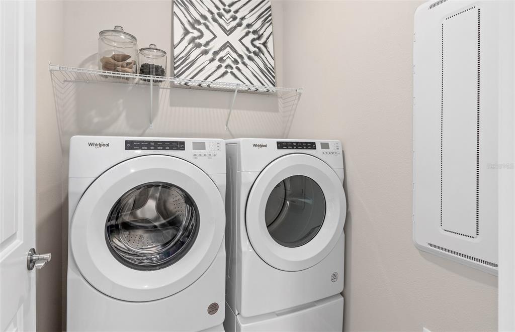 2382 Lily Bloom Road St. Cloud, FL 34771 - Photo 22 of 22 a utility room with dryer and washer