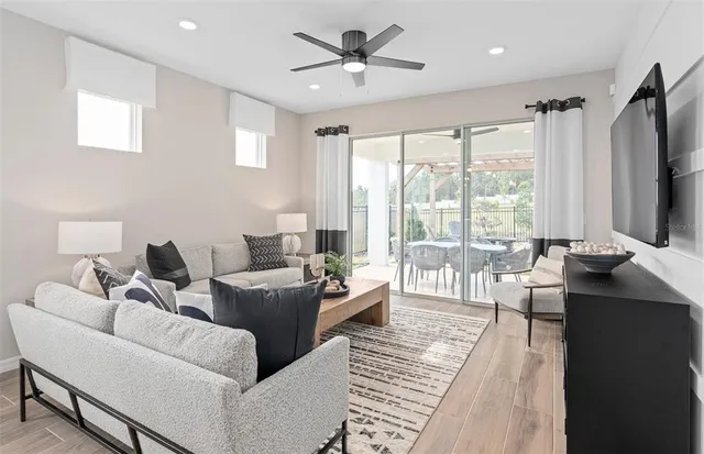 a living room with furniture and a large window