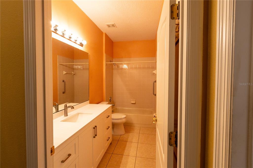 65 Calliope Street Ocoee, FL 34761 - Photo 28 of 60 a bathroom with a double vanity sink and a mirror
