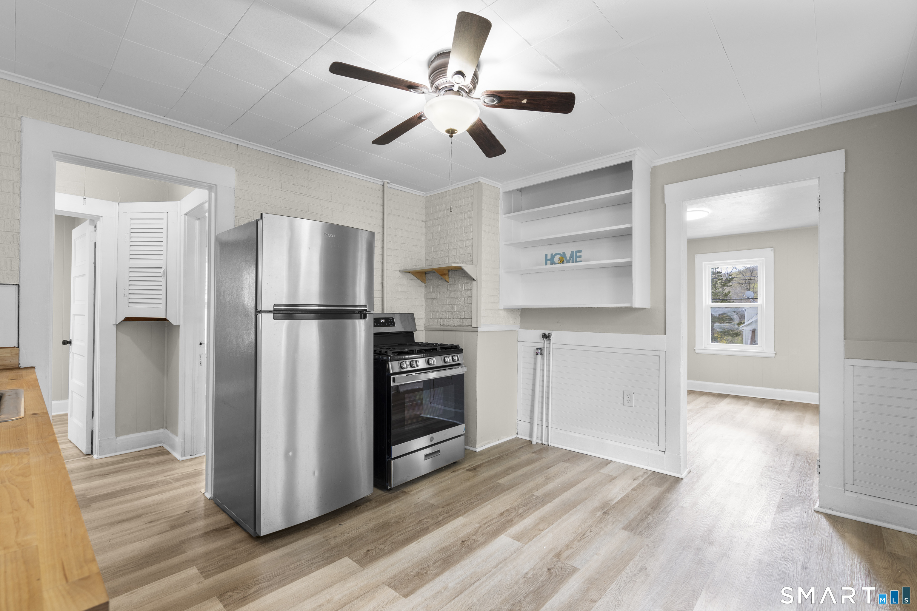 88 North Pond Street Bristol, CT 06010 - Photo 11 of 32 a kitchen with stainless steel appliances a refrigerator and a stove