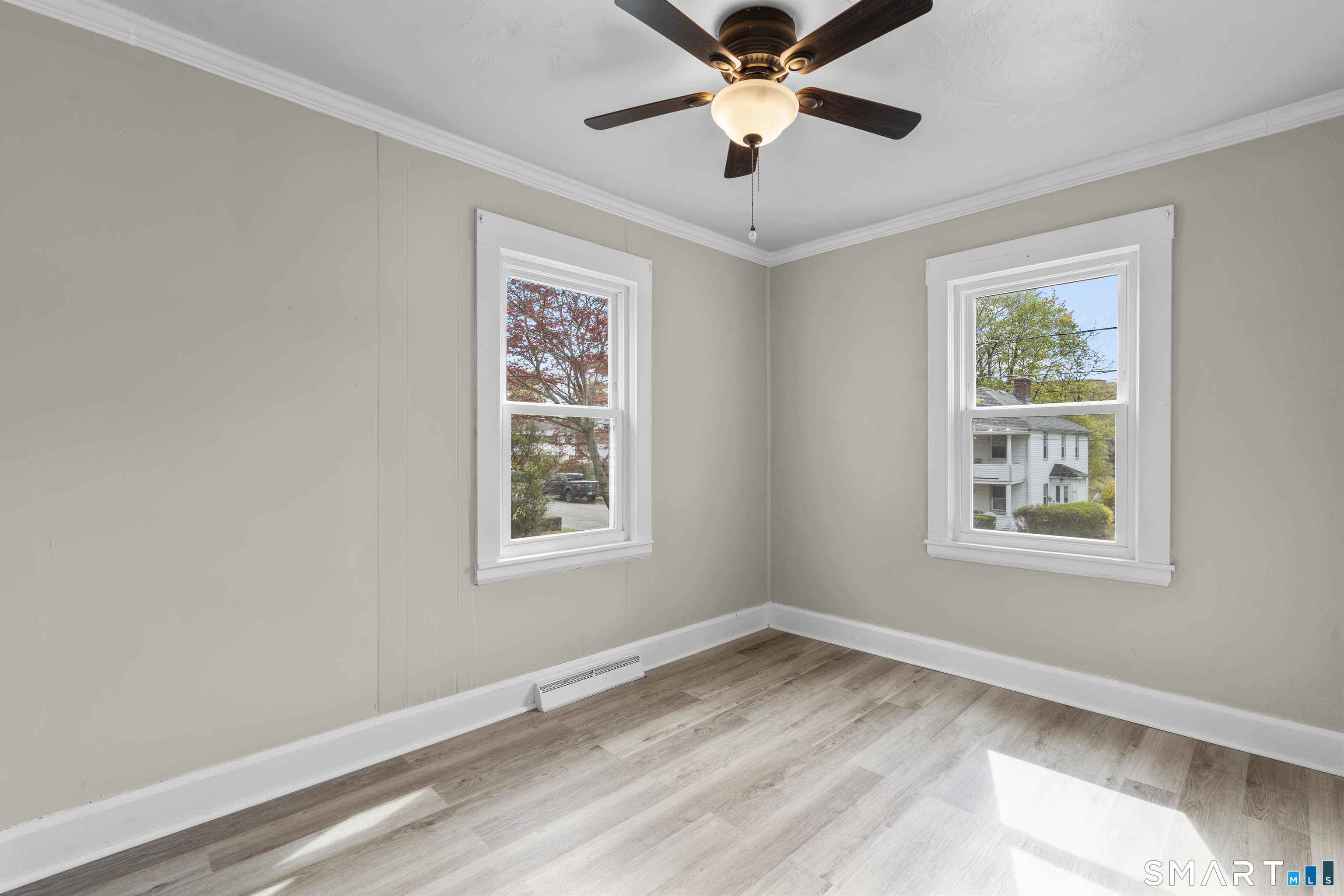 88 North Pond Street Bristol, CT 06010 - Photo 12 of 32 a view of an empty room with a window and wooden floor
