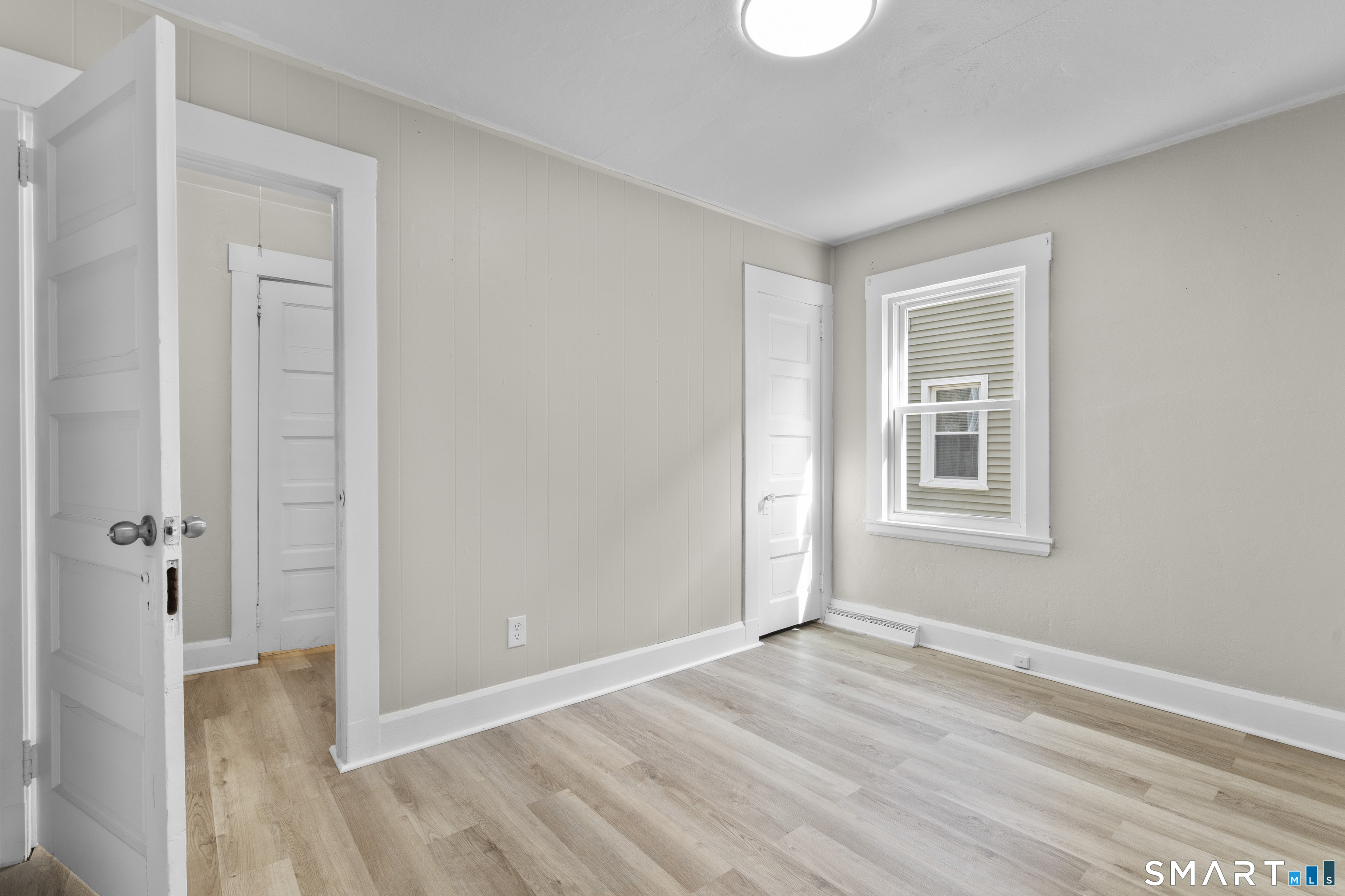 88 North Pond Street Bristol, CT 06010 - Photo 15 of 32 a view of an empty room with wooden floor and a window