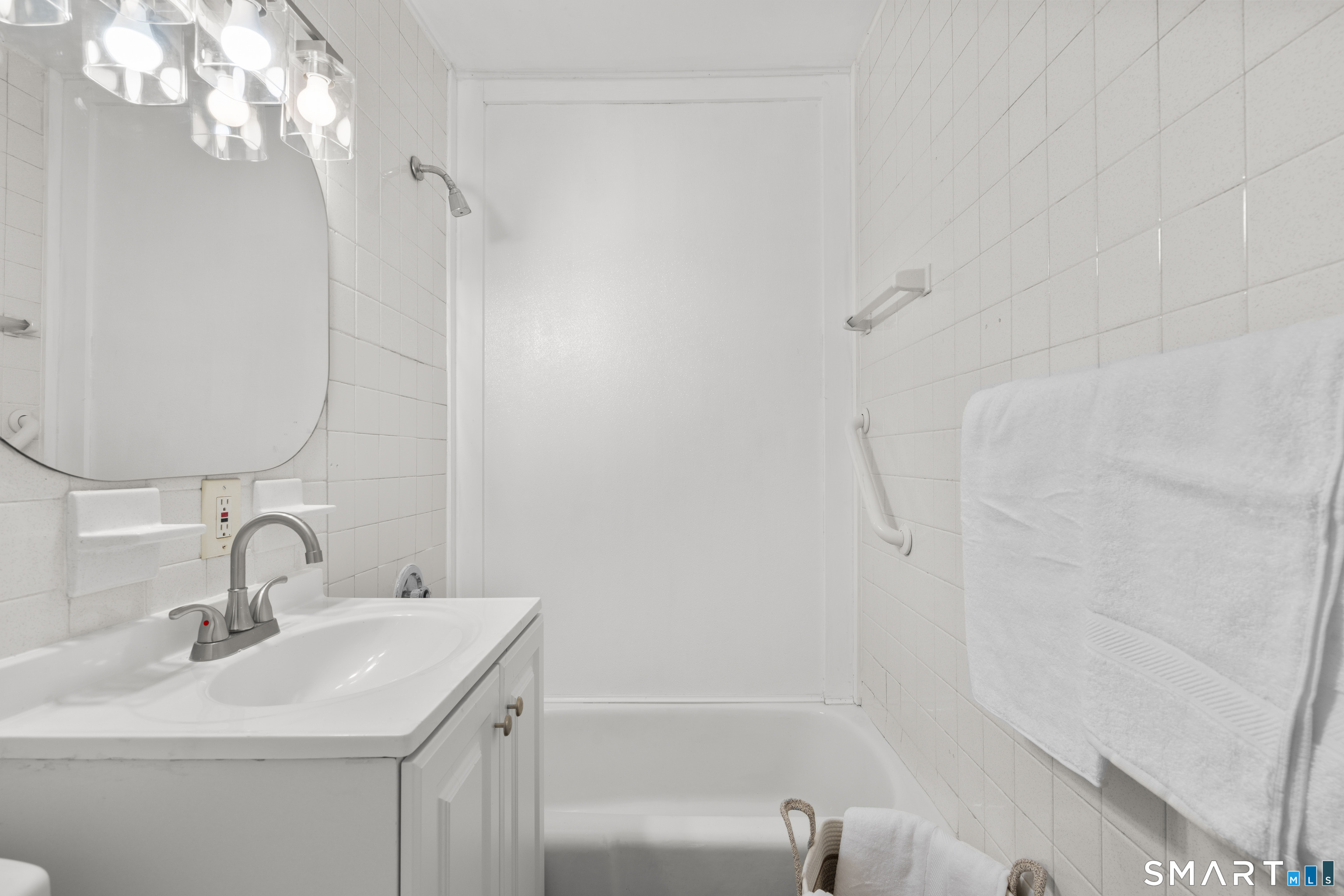 88 North Pond Street Bristol, CT 06010 - Photo 28 of 32 a bathroom with a sink and a mirror