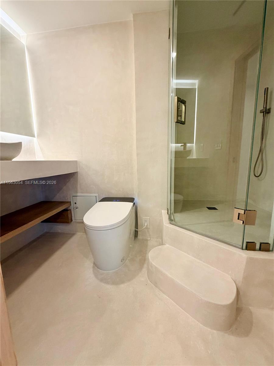 100 Lincoln Road, Unit 1241 Miami Beach, FL 33139 - Photo 8 of 18 a bathroom with a toilet and a shower