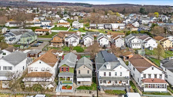 an aerial view of residential building and parking space