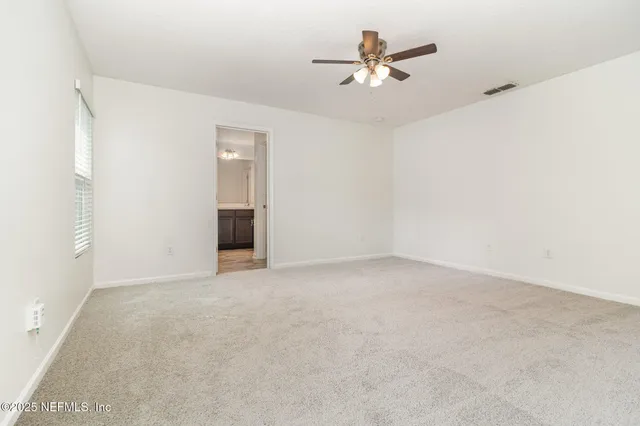 an empty room with a bathroom