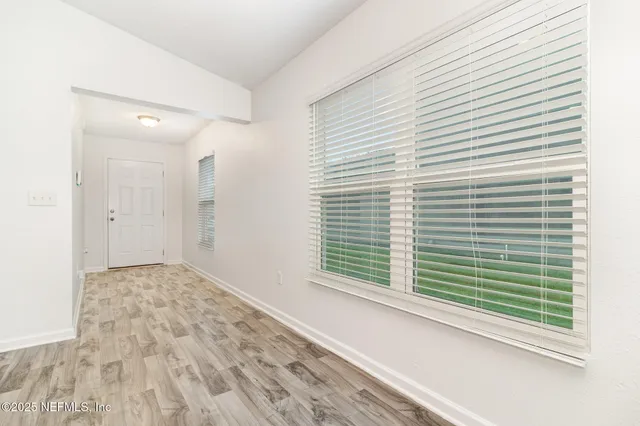 a view of a room with a large window