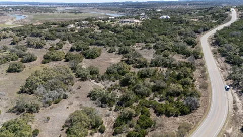 an aerial view of a houses with a yard
