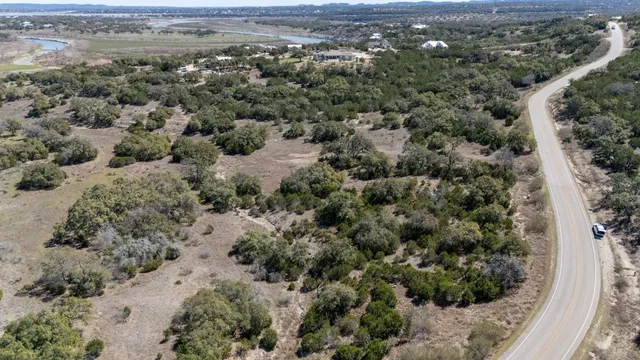 an aerial view of a houses with a yard