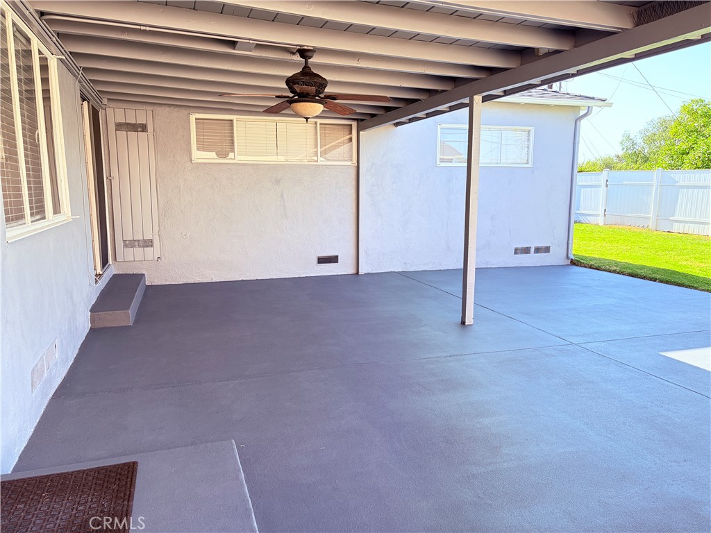 14820 Ragan Drive La Mirada, CA 90638 - Photo 22 of 27 Comfortable covered backyard patio with ceiling fan and new concrete.