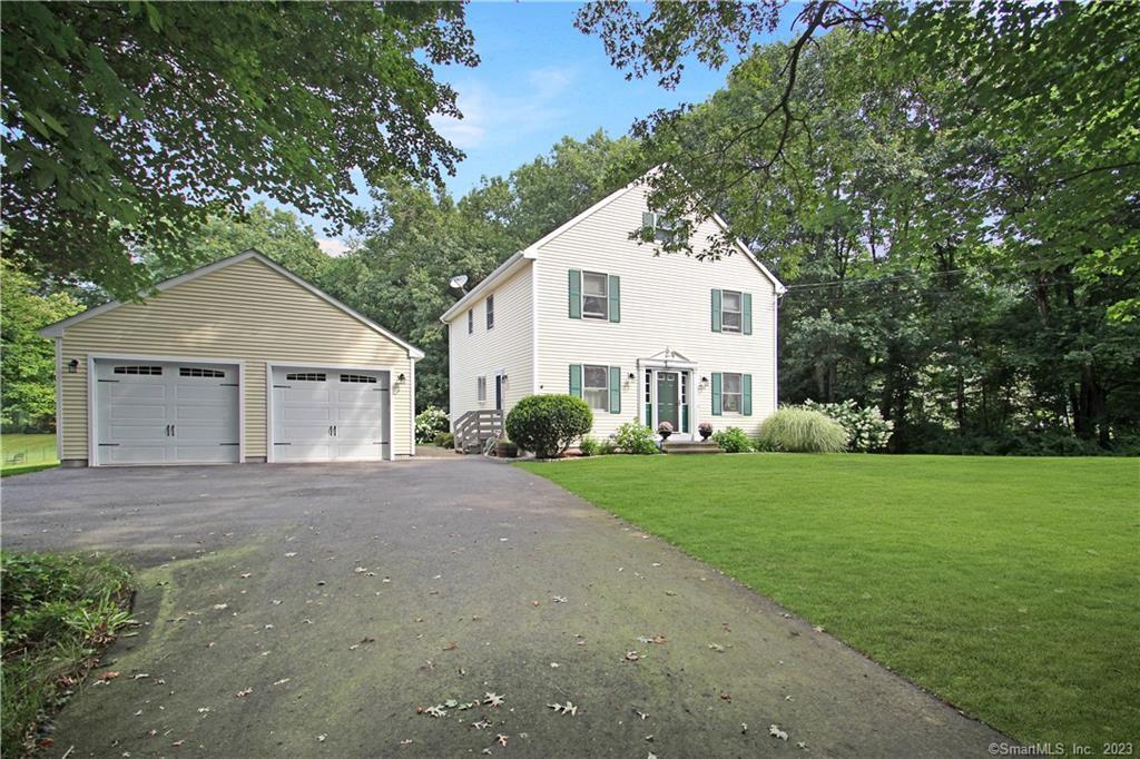 a view of a house with a yard