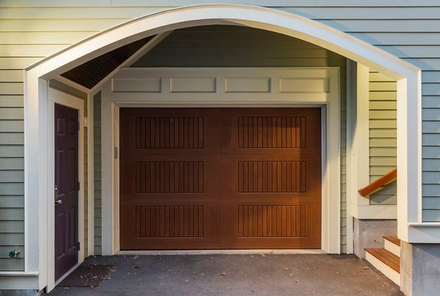 a front view of a house with a garage