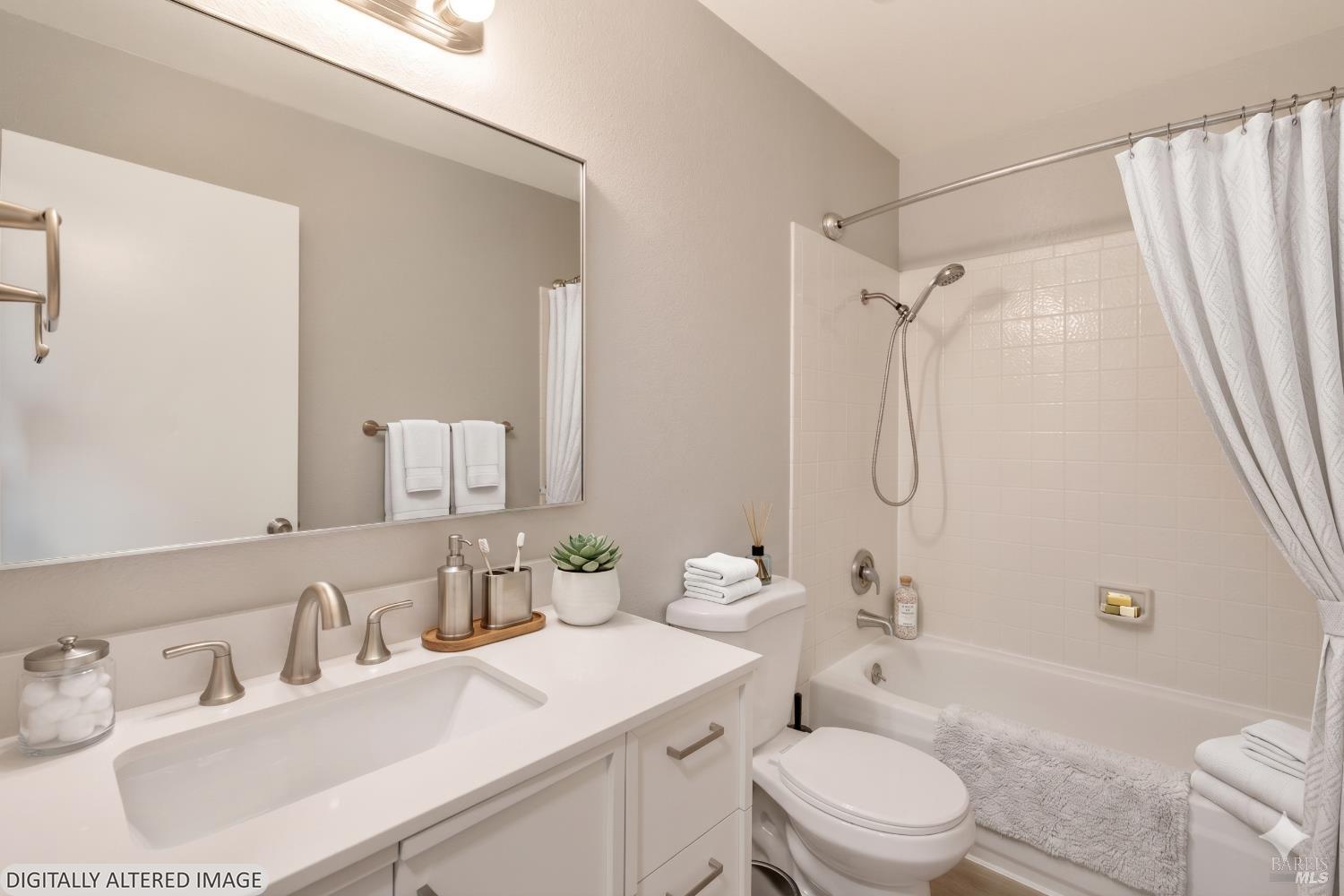 735 Blair Place Santa Rosa, CA 95401 - Photo 4 of 16 a bathroom with a sink toilet vanity and shower