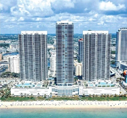 a view of building with yard and staircase