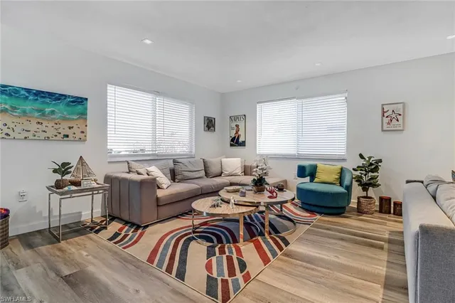 a living room with furniture and windows