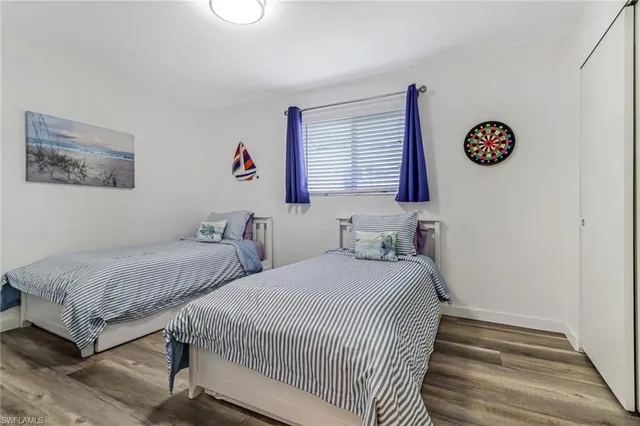 a bedroom with double bed and a window