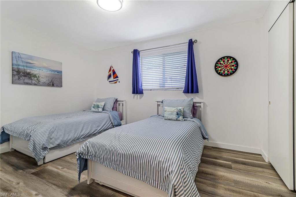 724 100th Avenue North Naples, FL 34108 - Photo 14 of 31 a bedroom with double bed and a window