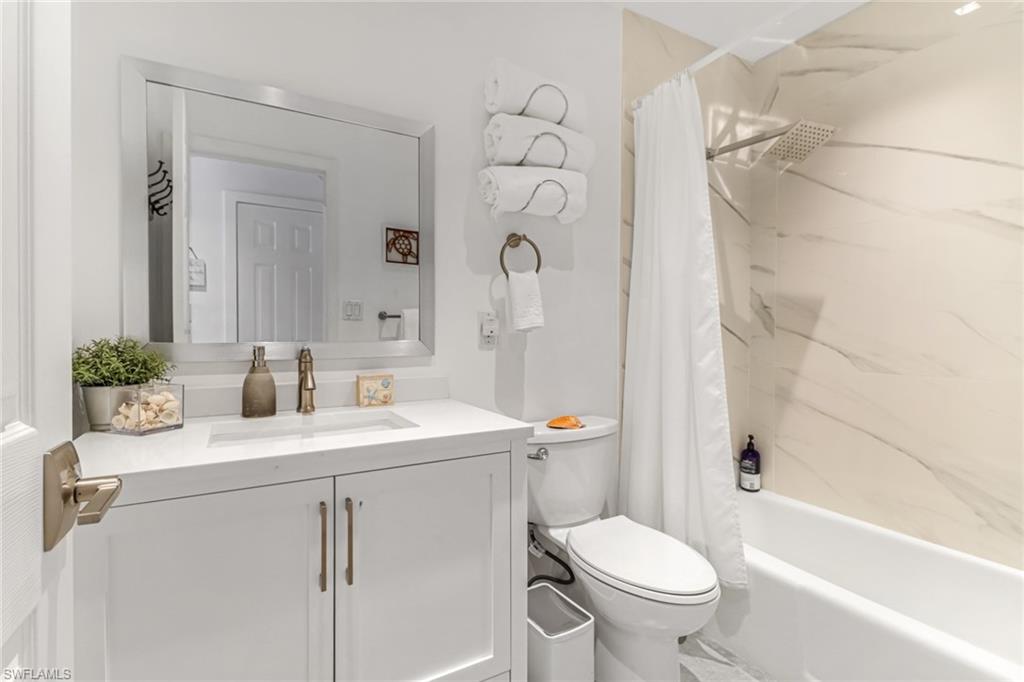 724 100th Avenue North Naples, FL 34108 - Photo 15 of 31 a bathroom with a sink toilet and shower