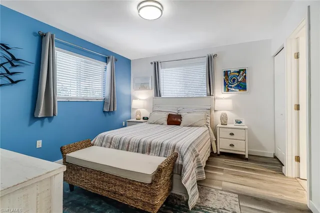 a bedroom with a large bed and a window