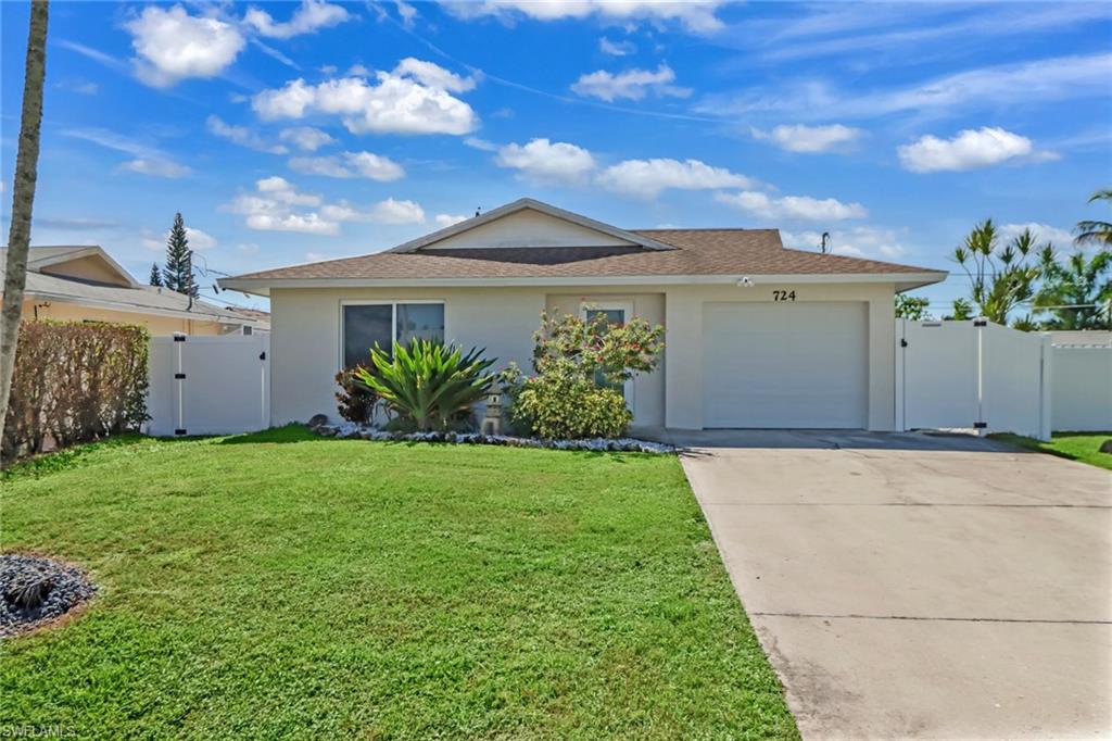 724 100th Avenue North Naples, FL 34108 - Photo 2 of 31 a view of a house with a yard