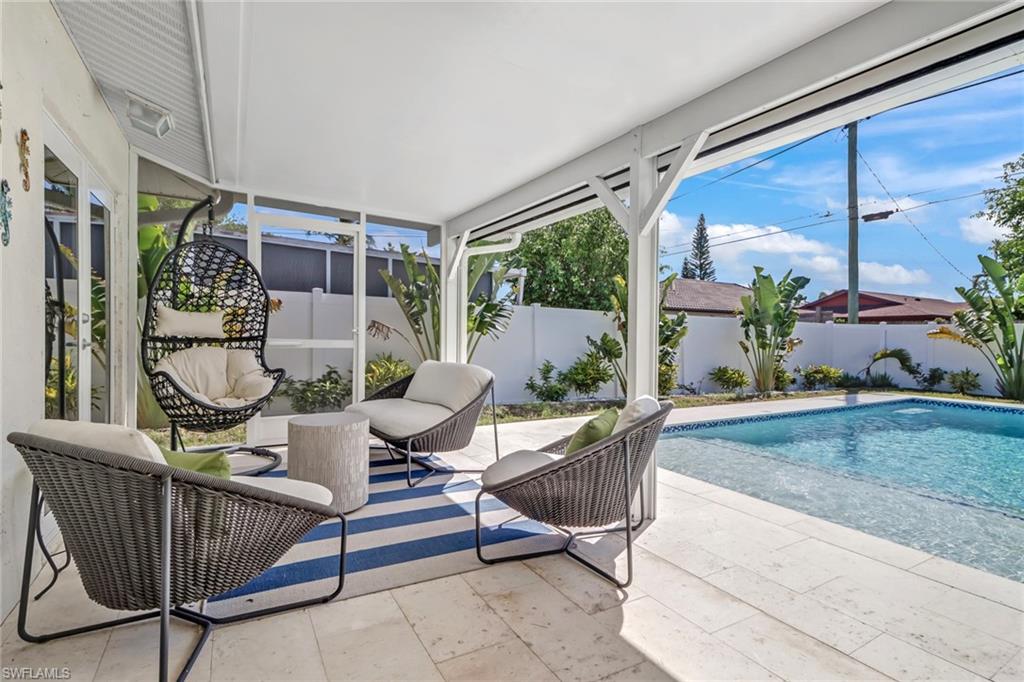 724 100th Avenue North Naples, FL 34108 - Photo 23 of 31 a view of porch with a table and chairs