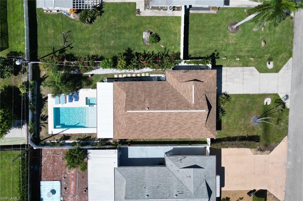 724 100th Avenue North Naples, FL 34108 - Photo 27 of 31 an aerial view of a house with a yard