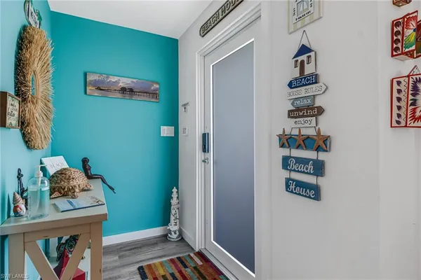 a view of hallway with stairs and toys