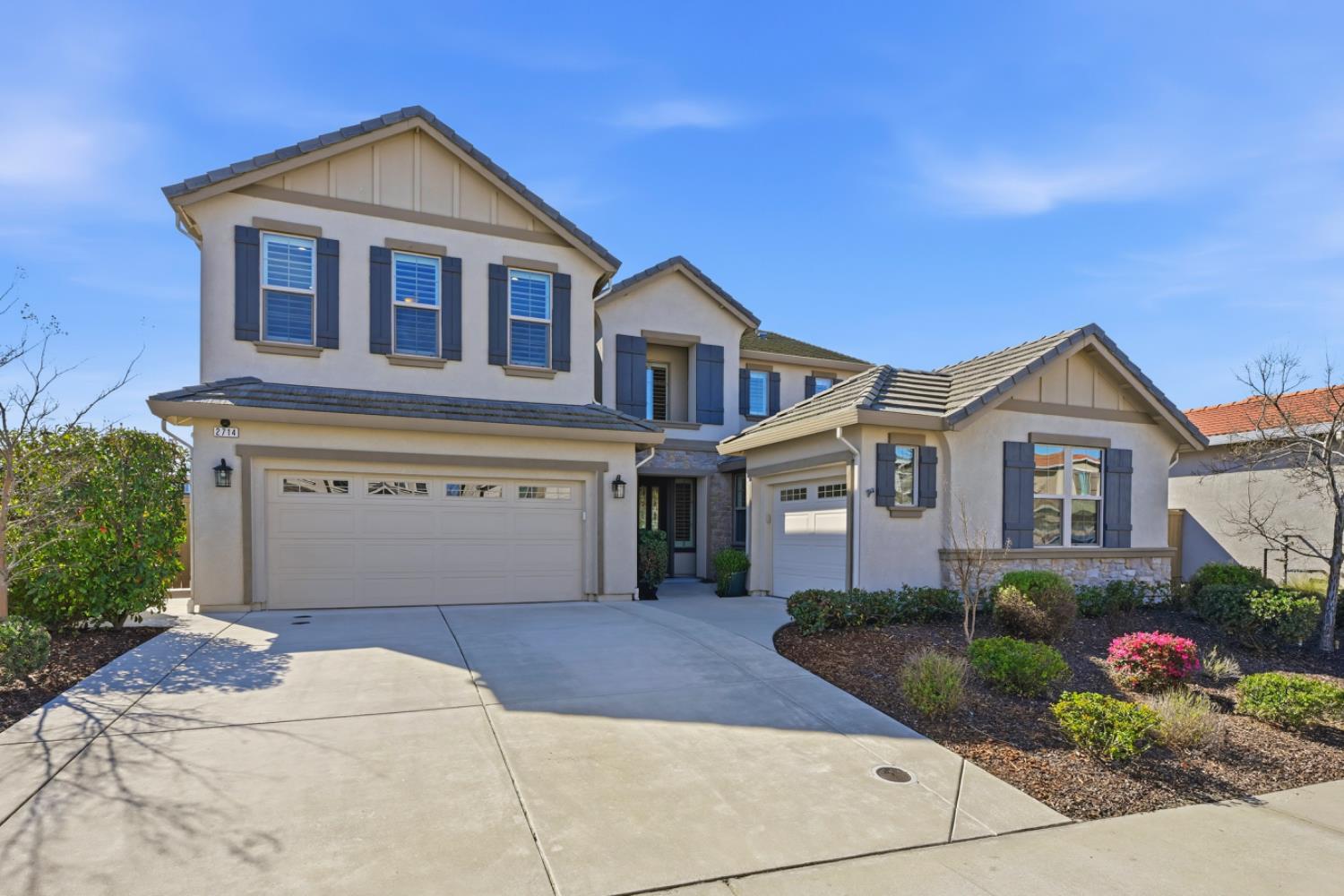 2714 Hidden Trail Loop Rocklin, CA 95765 - Photo 1 of 57 a front view of a house with a garden