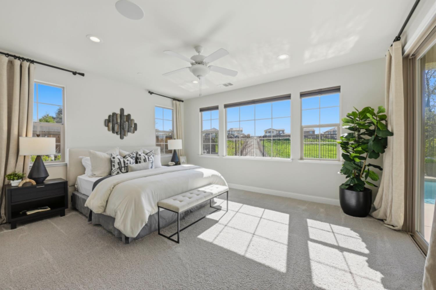 2714 Hidden Trail Loop Rocklin, CA 95765 - Photo 22 of 57 a bed room with a bed and a potted plant