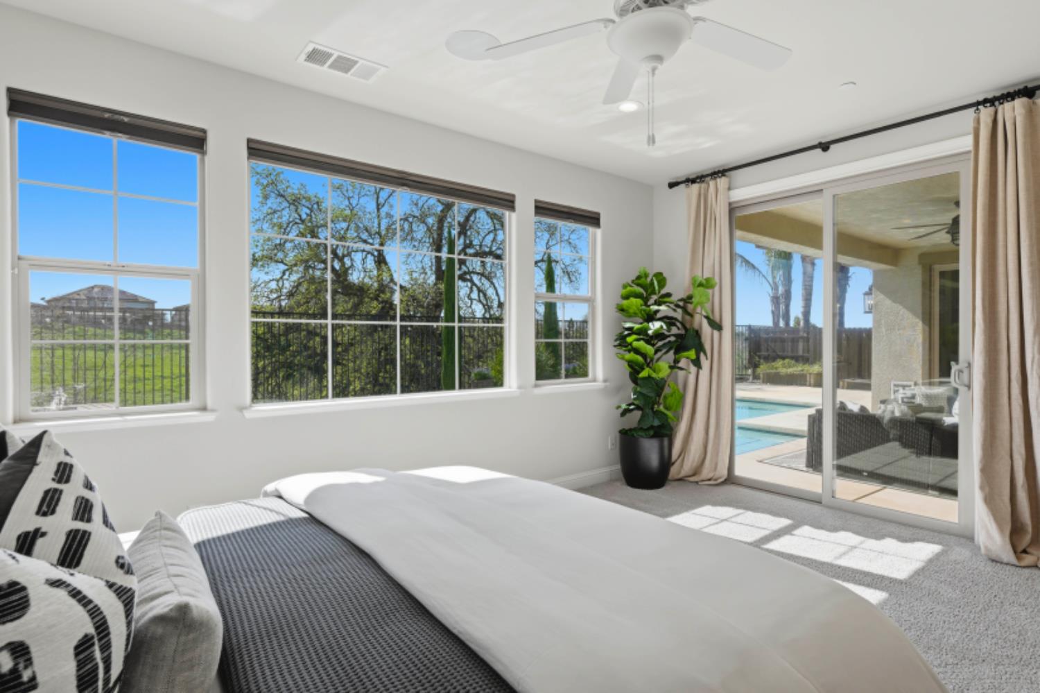 2714 Hidden Trail Loop Rocklin, CA 95765 - Photo 23 of 57 a living room with furniture and floor to ceiling windows
