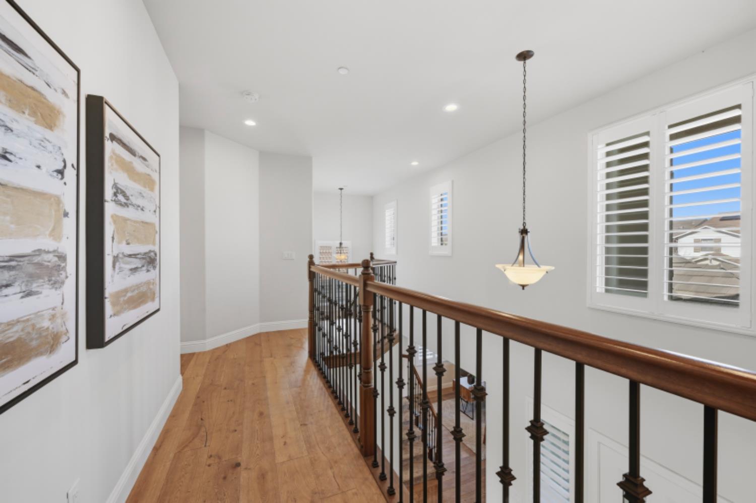 2714 Hidden Trail Loop Rocklin, CA 95765 - Photo 27 of 57 a view of a hallway with wooden floor and windows