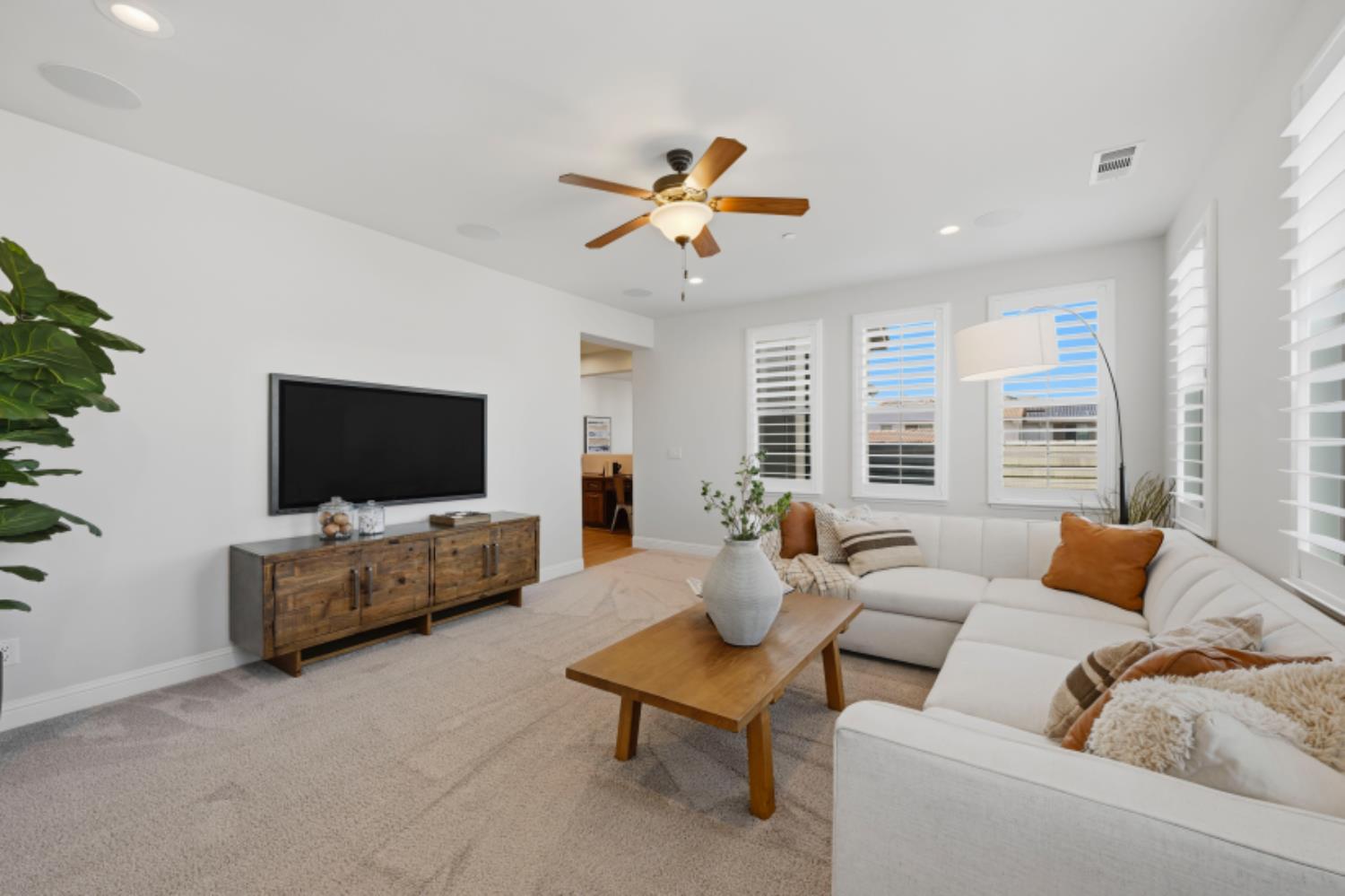 2714 Hidden Trail Loop Rocklin, CA 95765 - Photo 31 of 57 a living room with furniture and a flat screen tv