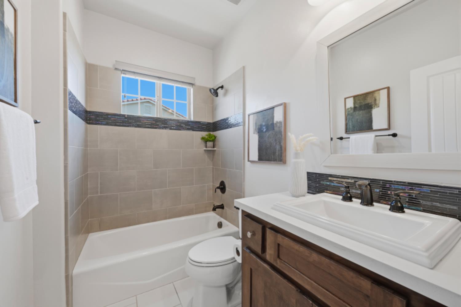 2714 Hidden Trail Loop Rocklin, CA 95765 - Photo 33 of 57 a bathroom with a sink a toilet and bathtub