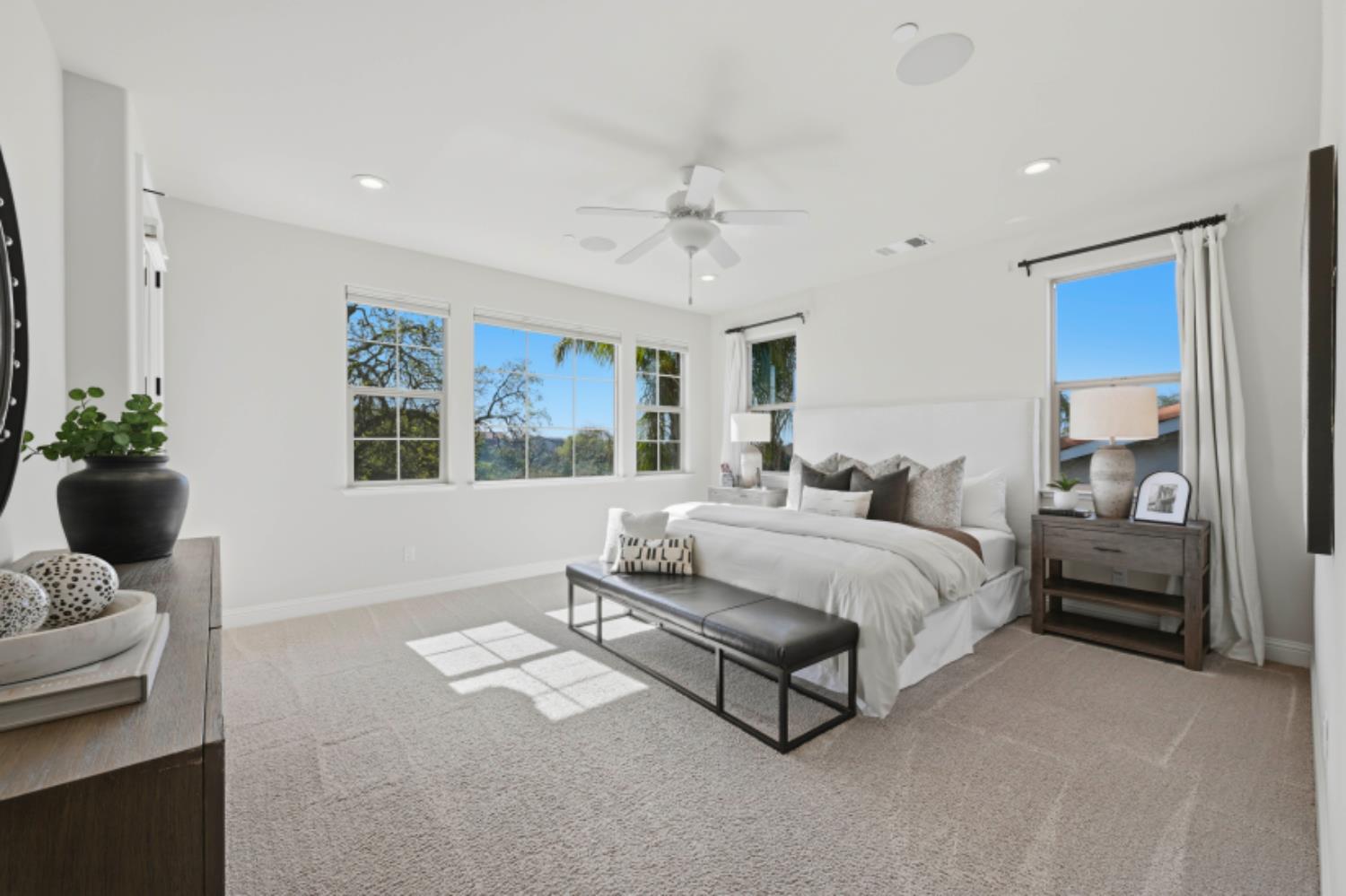 2714 Hidden Trail Loop Rocklin, CA 95765 - Photo 34 of 57 a spacious bedroom with a bed and a couch