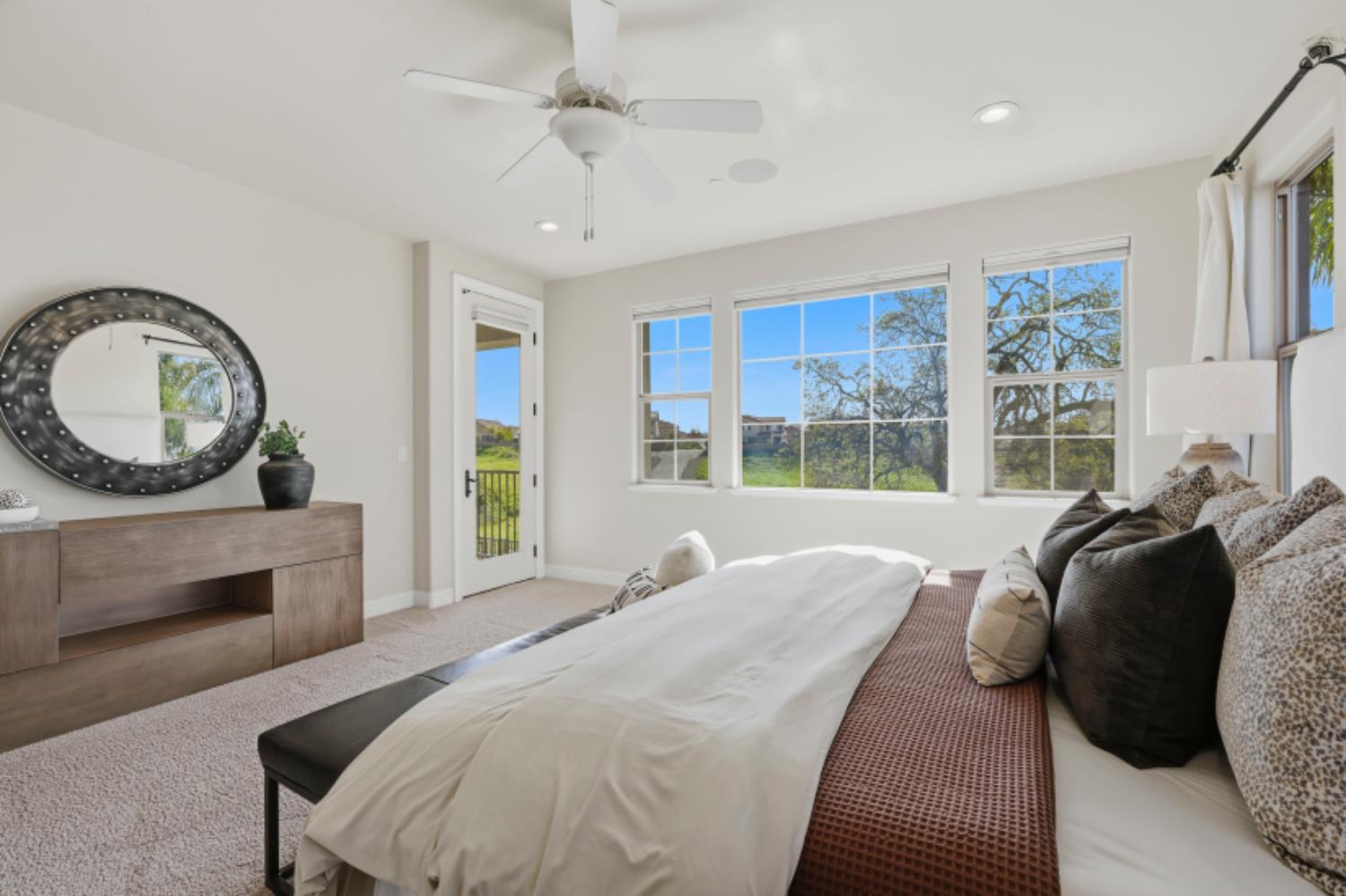 2714 Hidden Trail Loop Rocklin, CA 95765 - Photo 36 of 57 a spacious bedroom with a bed a mirror and a large window