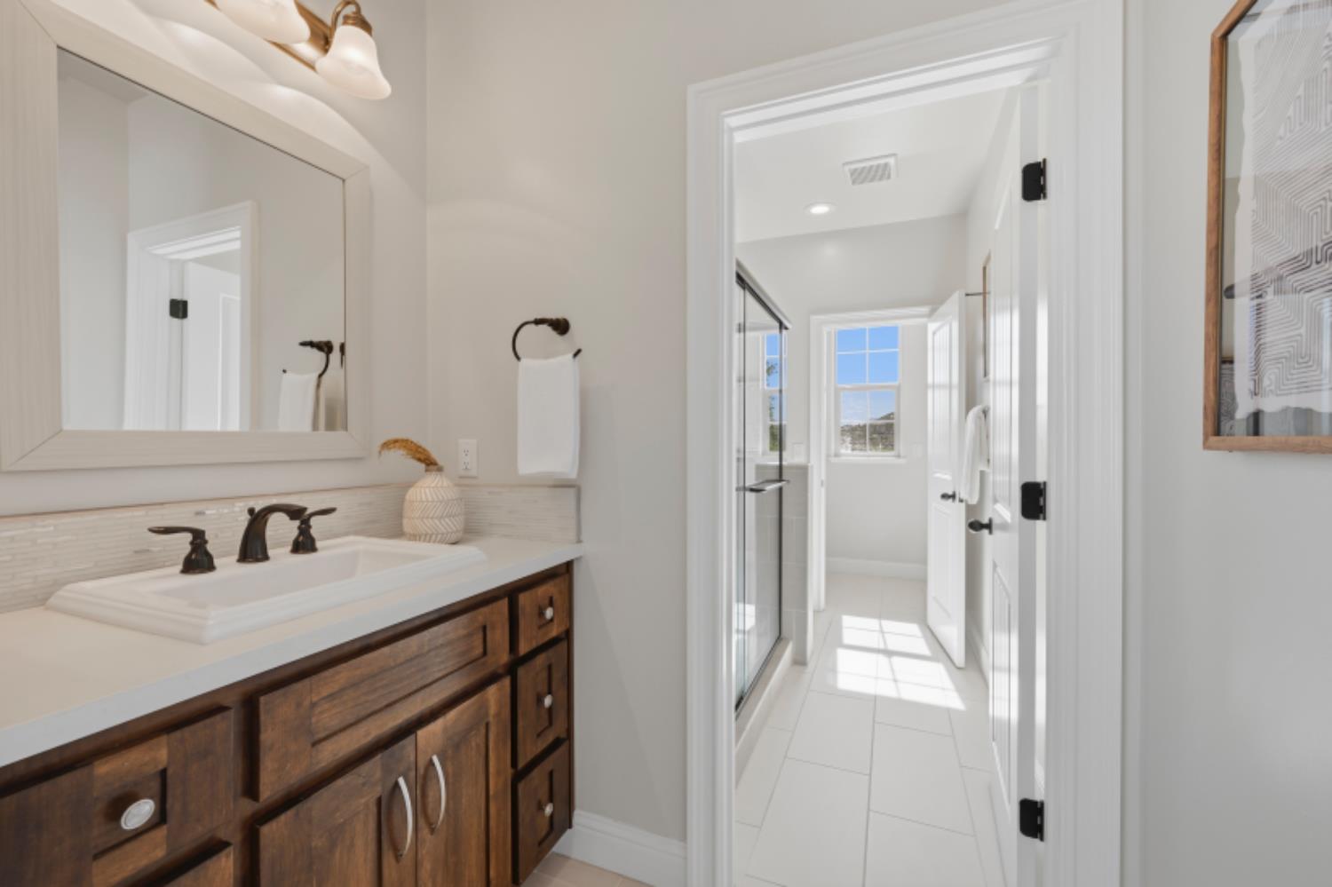 2714 Hidden Trail Loop Rocklin, CA 95765 - Photo 42 of 57 a bathroom with a sink double vanity and a mirror