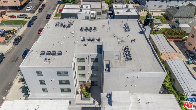an aerial view of residential house with parking