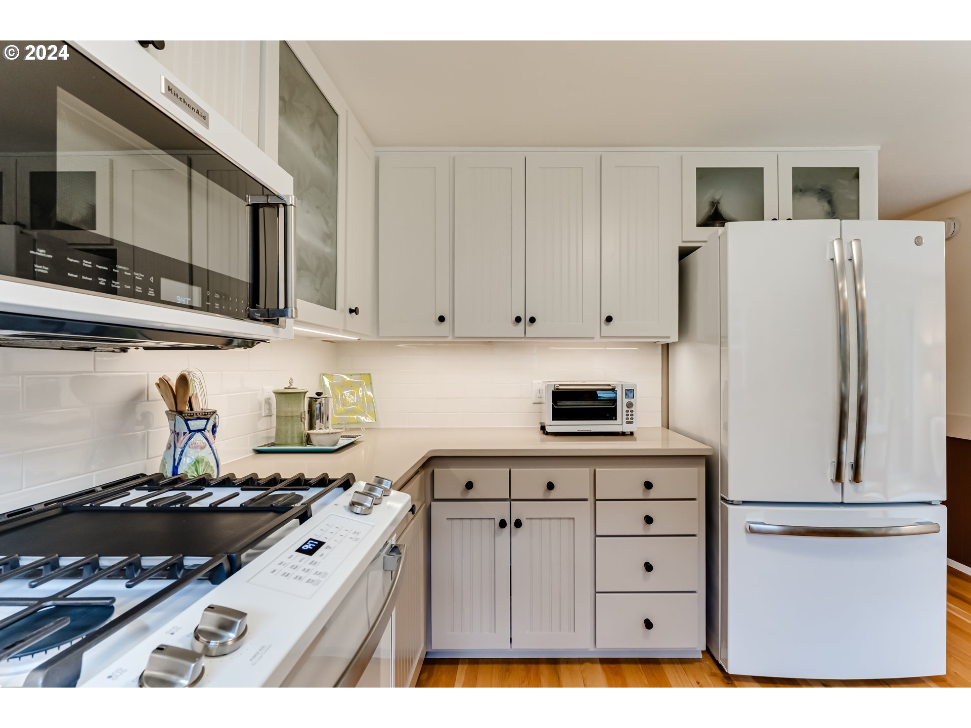145 Westbrook Way Eugene, OR 97405 - Photo 17 of 48 a kitchen with refrigerator and cabinets