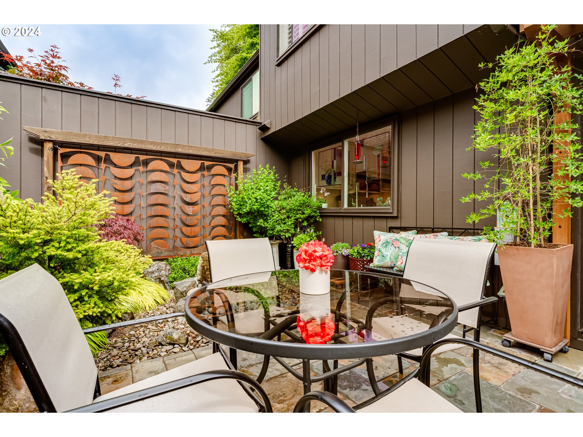 145 Westbrook Way Eugene, OR 97405 - Photo 41 of 48 a view of a patio with table and chairs and potted plants