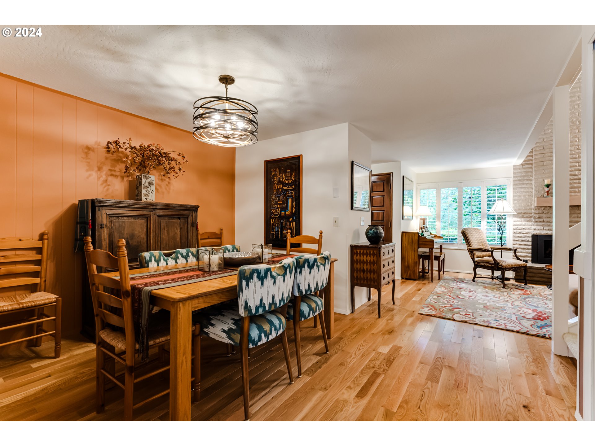 145 Westbrook Way Eugene, OR 97405 - Photo 10 of 48 a dining room with furniture a chandelier and wooden floor