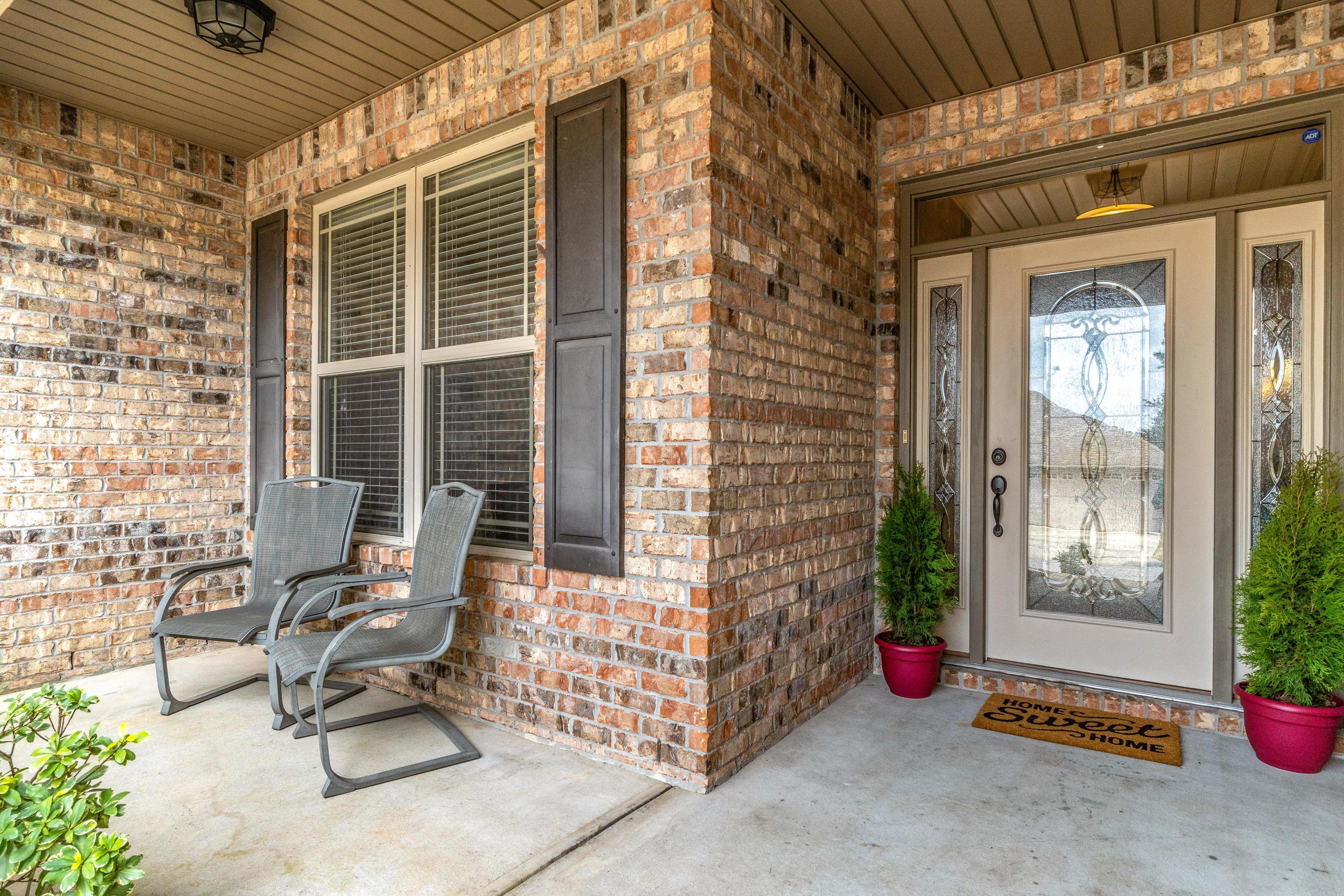 4624 Hermosa Road Crestview, FL 32539 - Photo 2 of 32 a view of two chairs in the balcony