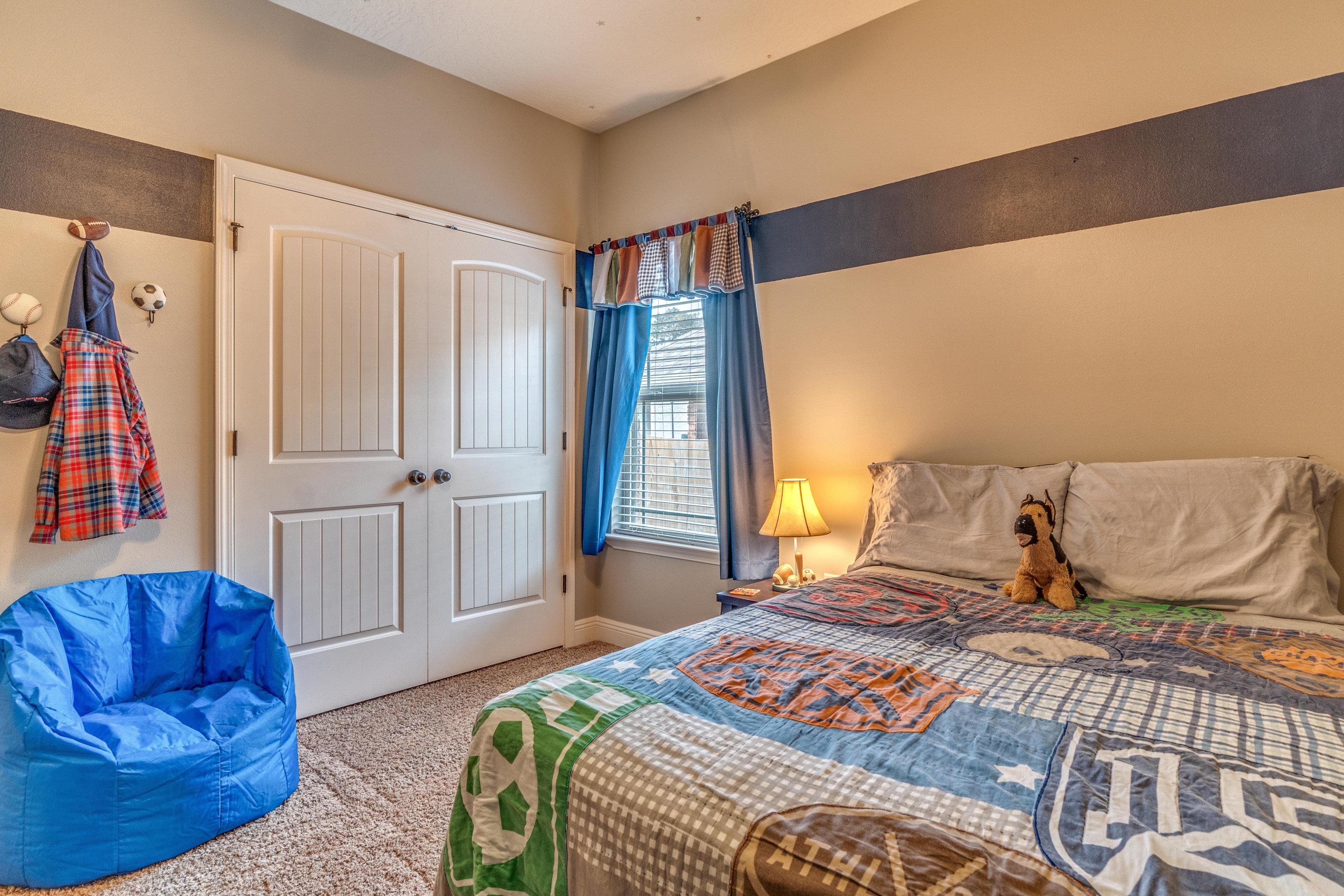 4624 Hermosa Road Crestview, FL 32539 - Photo 23 of 32 a bedroom with a bed and wooden floor